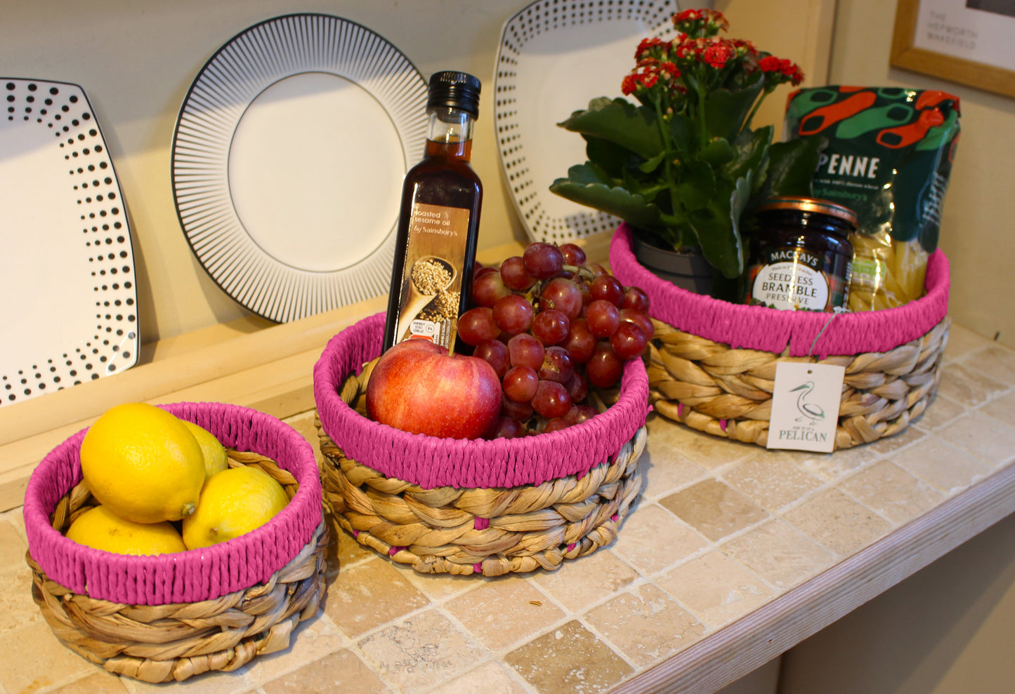Small water hyacinth round baskets with pink edges