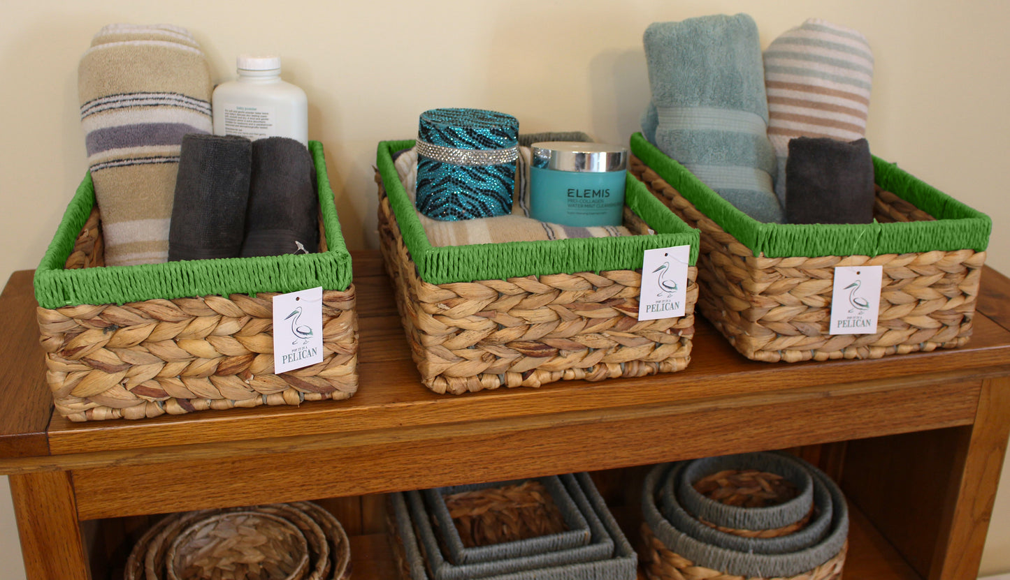 Small water hyacinth rectangular baskets with green edges.