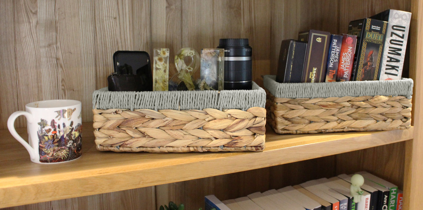 Small water hyacinth rectangular baskets with grey edges.