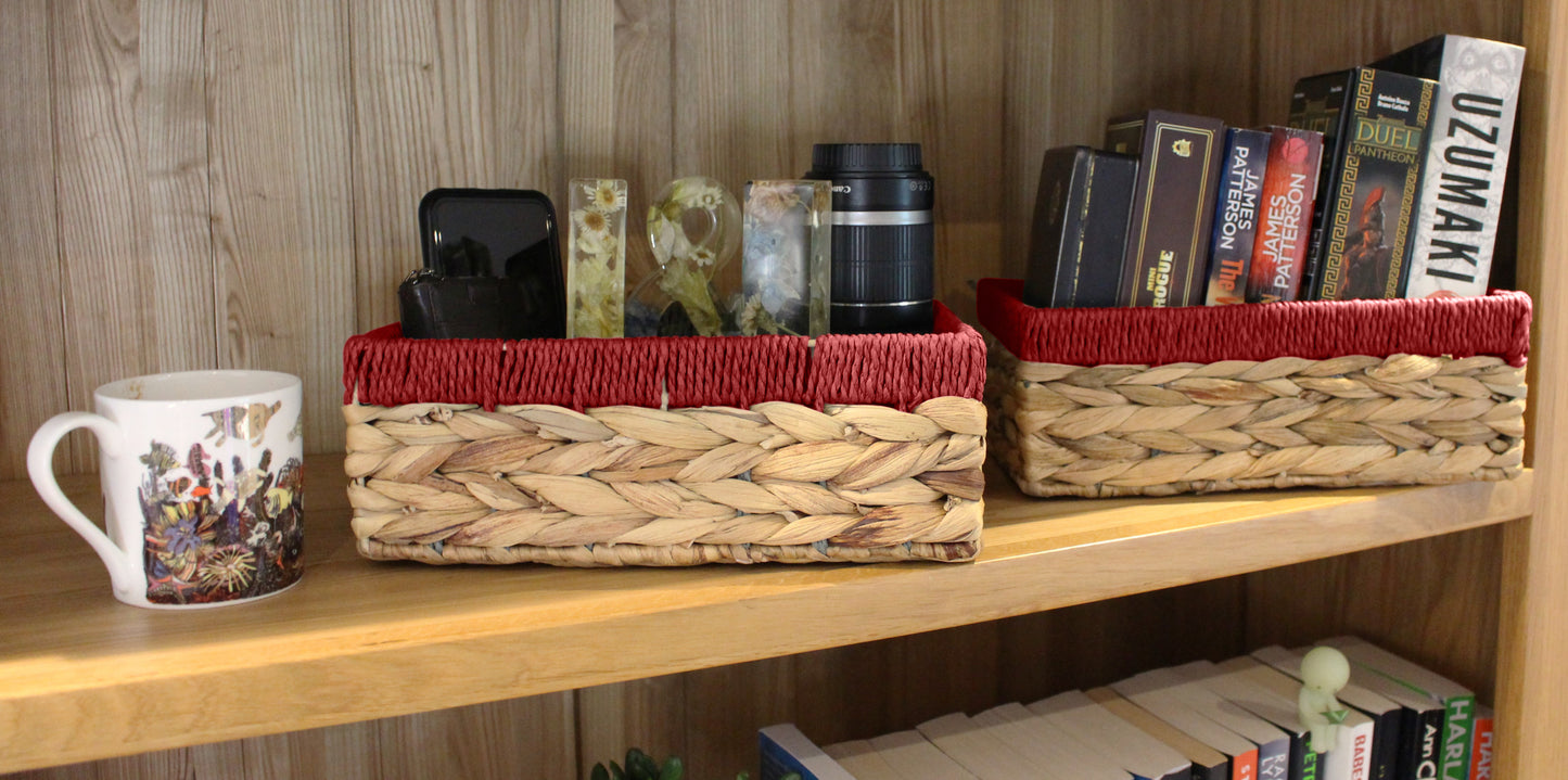 Small water hyacinth rectangular baskets with red edges.