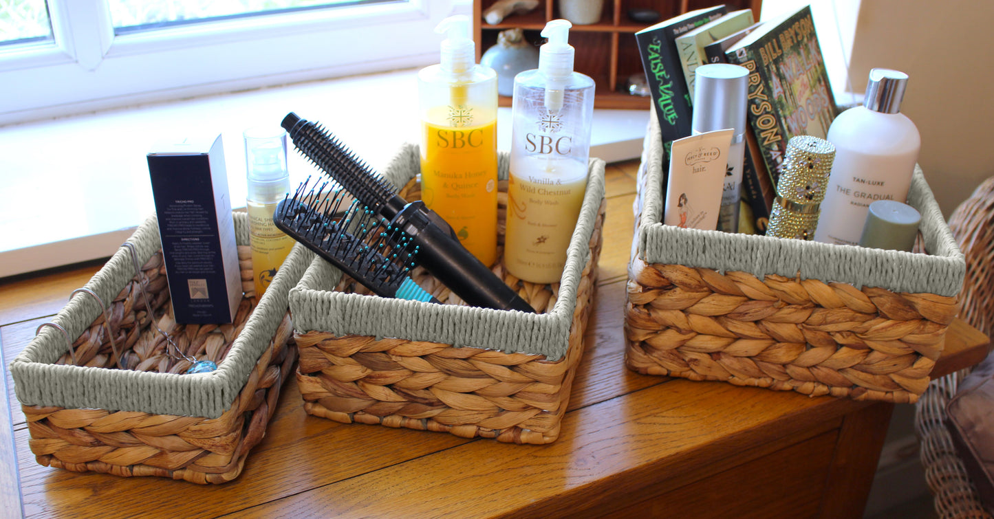 Small water hyacinth rectangular baskets with grey edges.