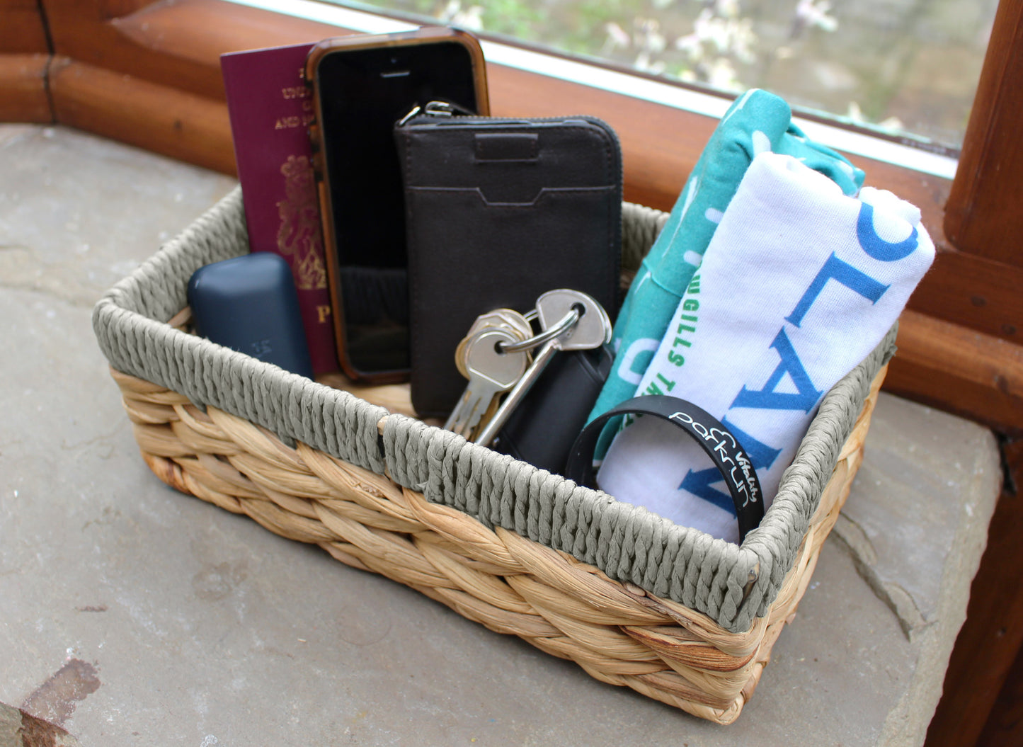 Small water hyacinth rectangular baskets with grey edges.