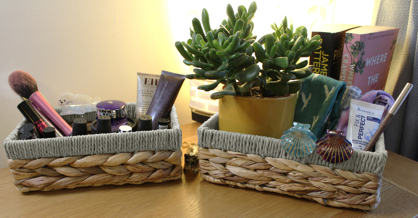 Small water hyacinth rectangular baskets with grey edges.