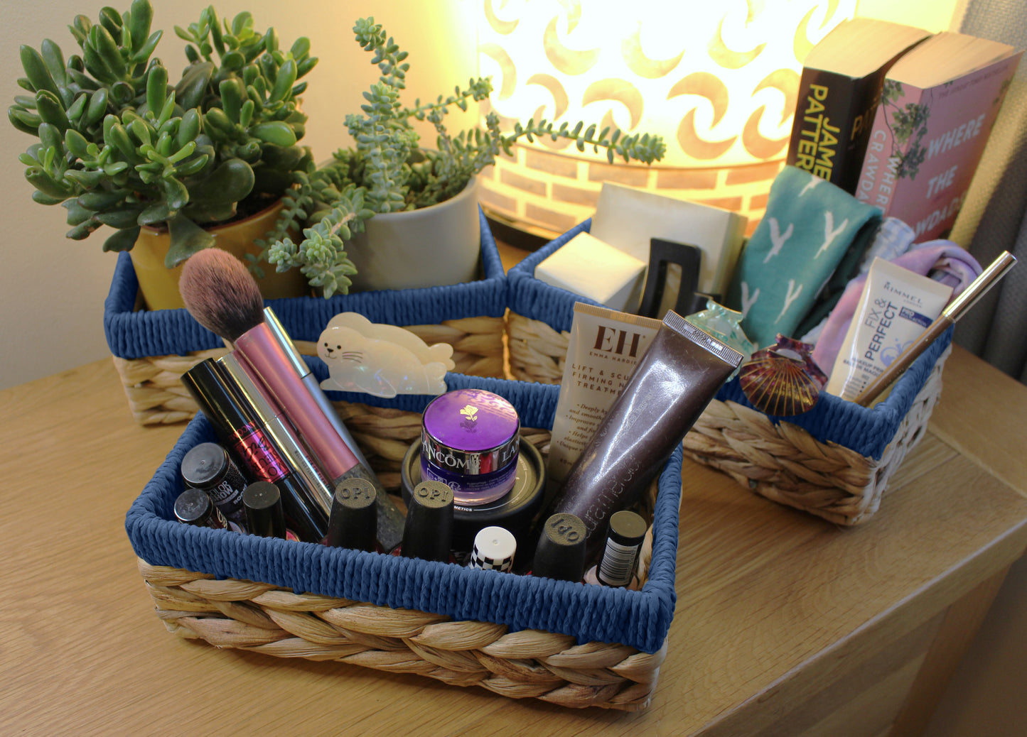 Small water hyacinth rectangular baskets with blue edges.