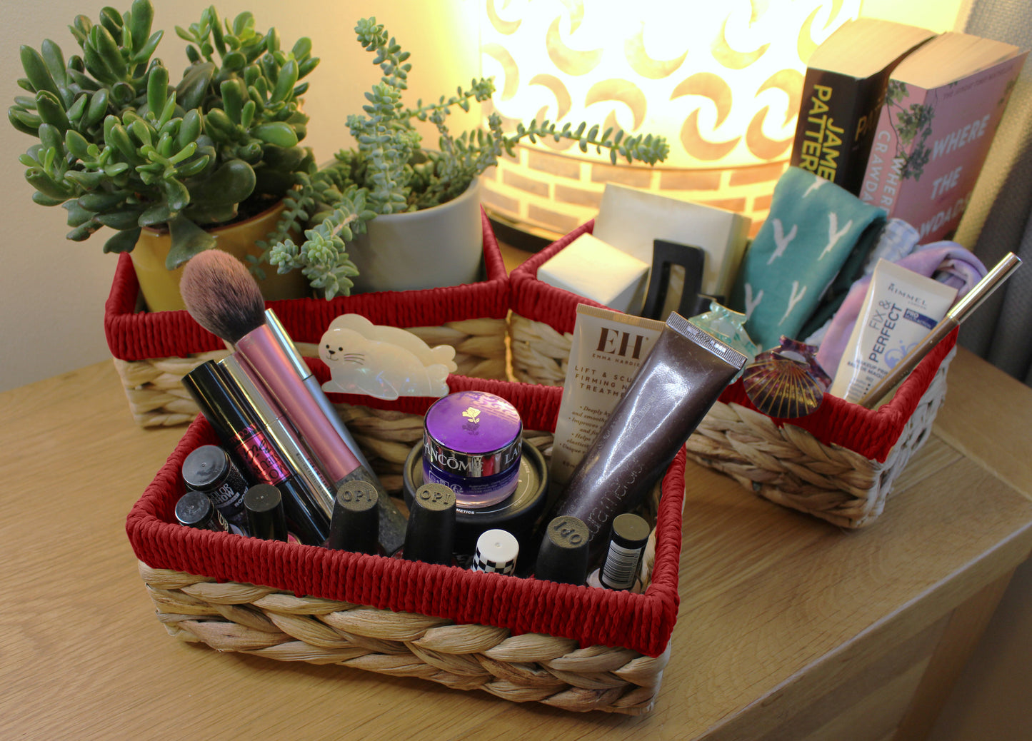 Small water hyacinth rectangular baskets with red edges.