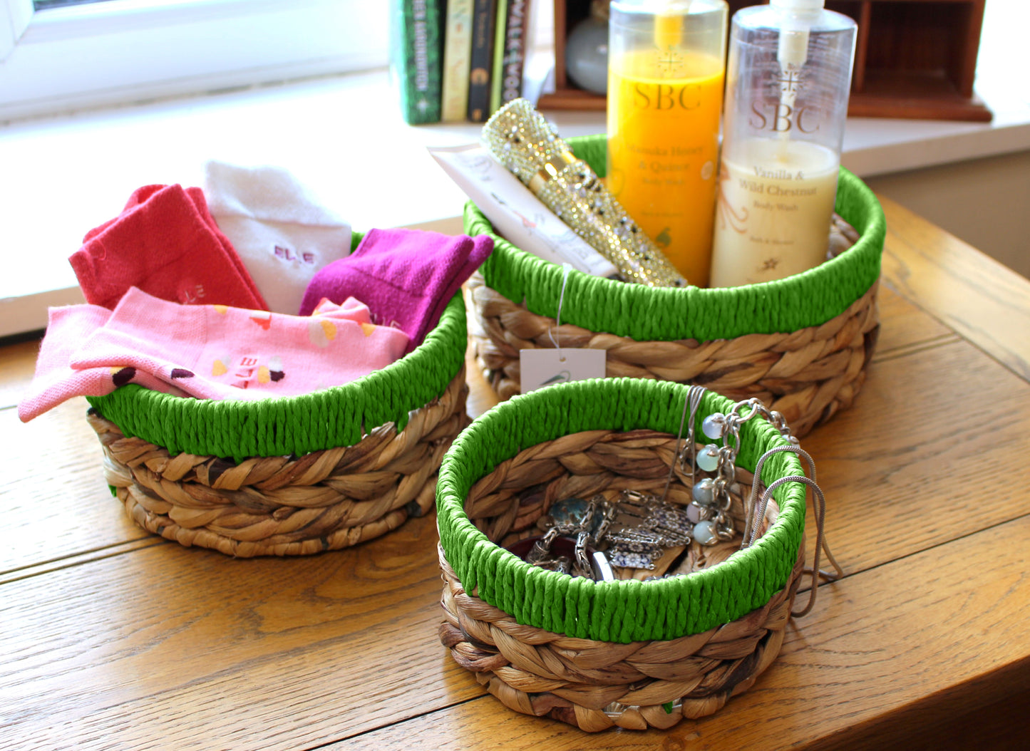 Small water hyacinth round baskets with green edges