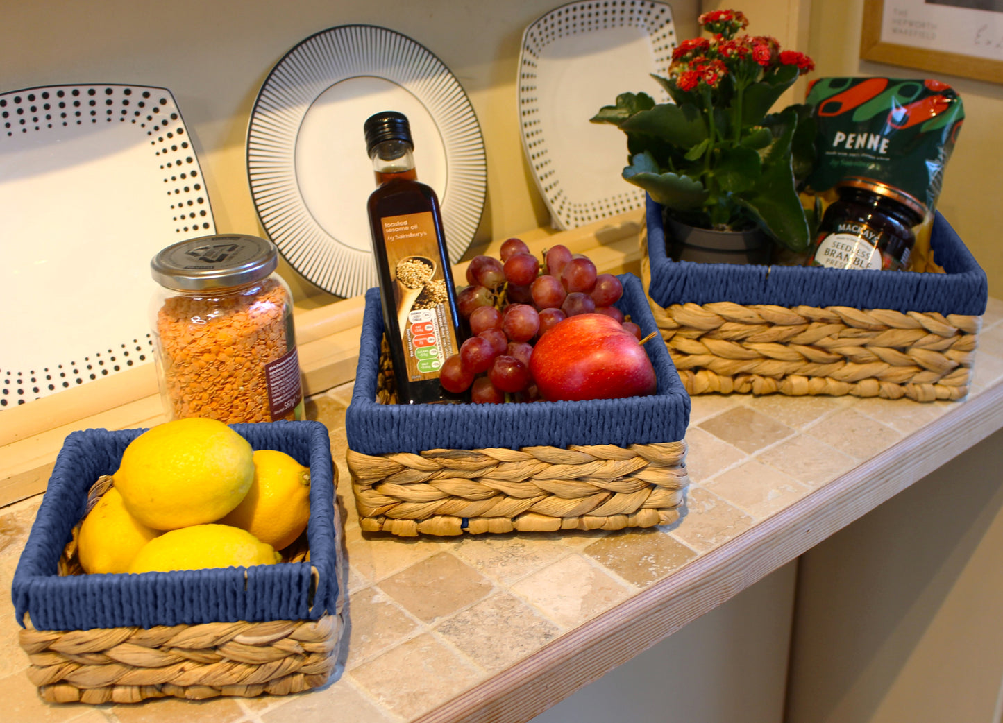 Small water hyacinth square baskets with blue edges.