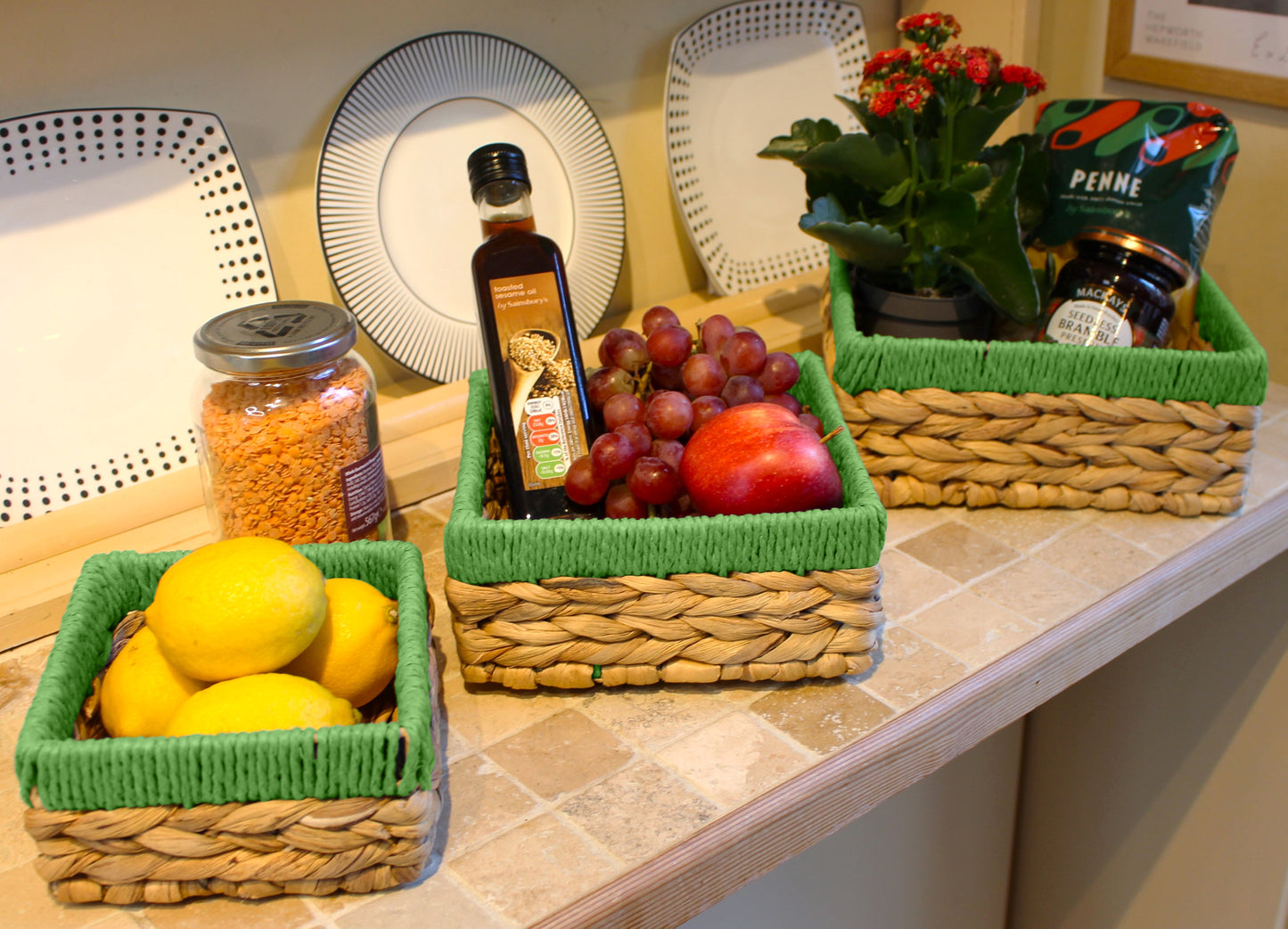 Small water hyacinth square baskets with green edges.
